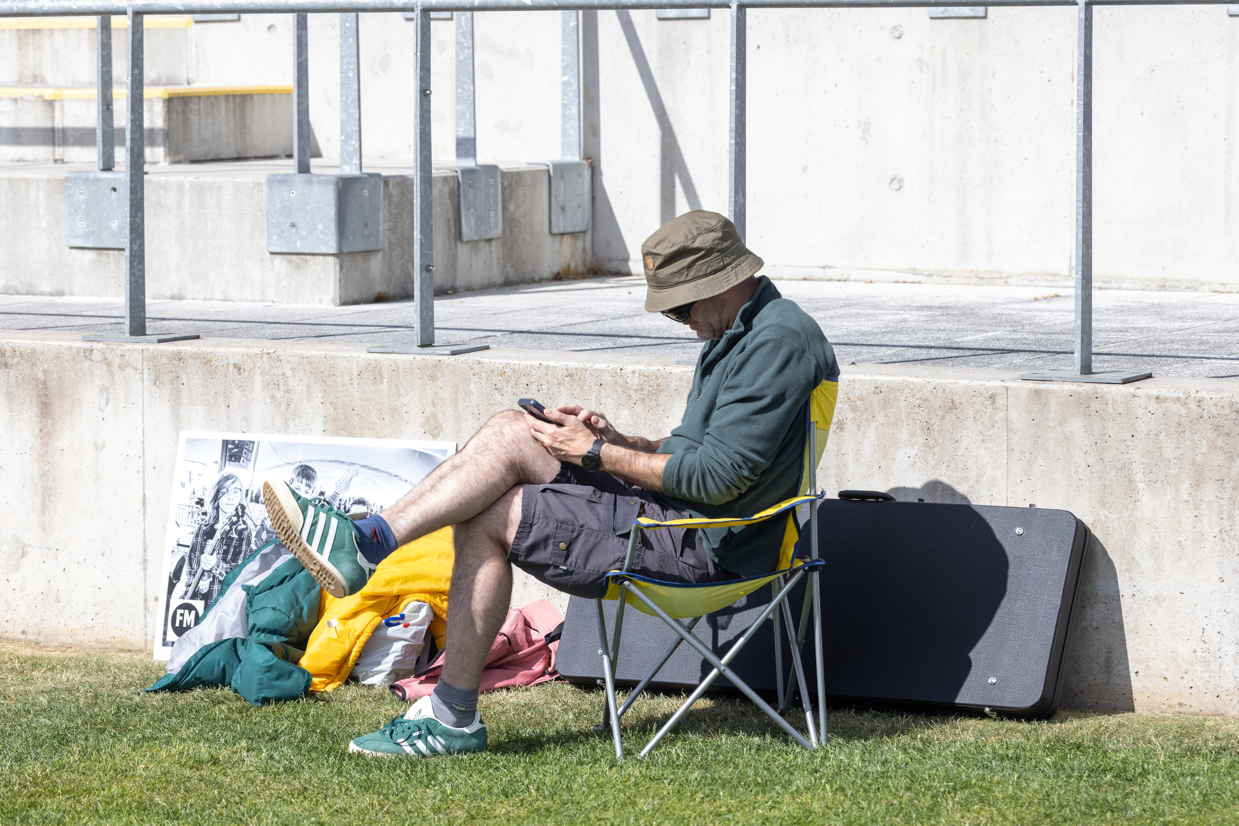 Person sat on lawn chair in the sun. 
